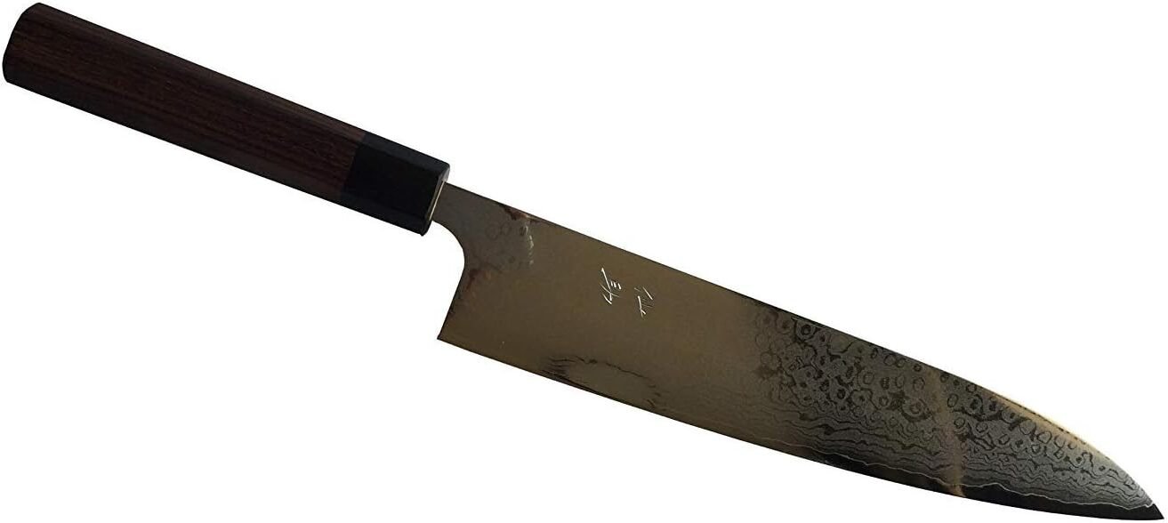 The image shows a Japanese chef’s knife with a dark wooden handle and a damascus-patterned blade. The blade features intricate wave-like patterns and has a sharp, pointed tip, typical of high-quality Japanese cutlery. There are small, engraved characters near the base of the blade, possibly indicating the product name or series, but the exact details are not visible in the image.