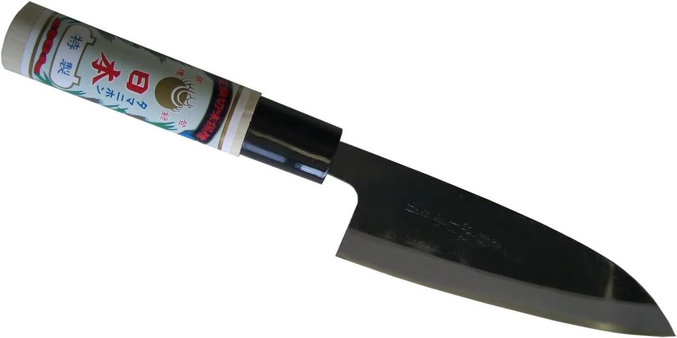 A Japanese knife is displayed against a white background. The knife features a traditional wooden handle with Japanese lettering and a sharp, curved stainless steel blade, highlighting its precise craftsmanship.